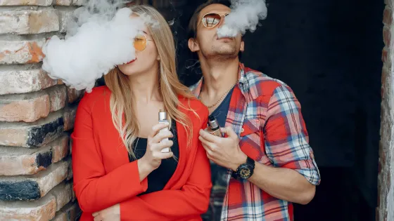 stylish-young-couple-with-vape-city