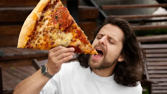 front-view-man-eating-giant-pizza-v1