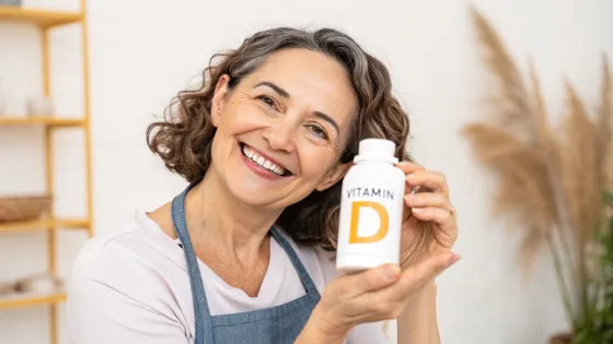 vitamin-d-is-held-in-the-hands-of-a-woman-of-about