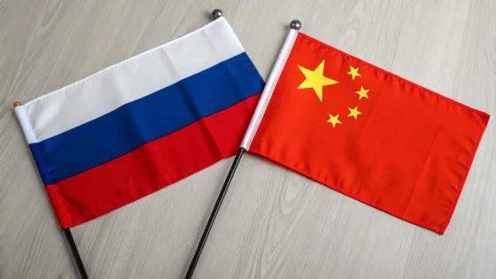 flag-of-russia-and-china-on-the-table