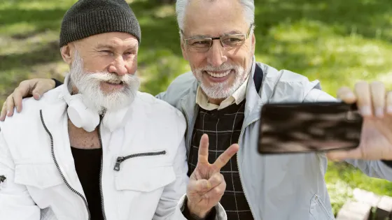 medium-shot-old-men-taking-selfies