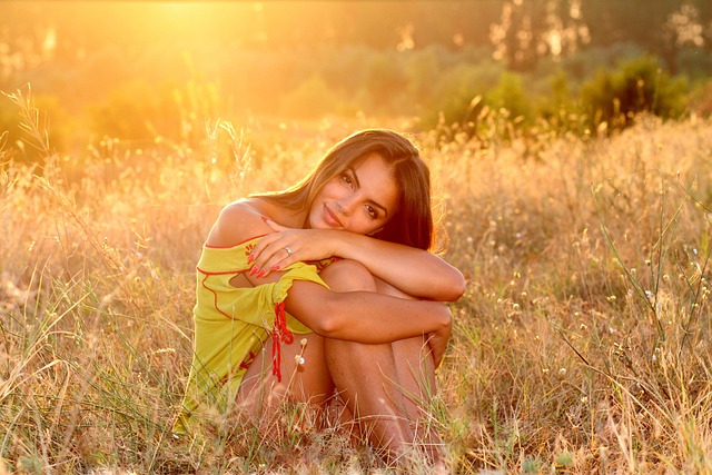 woman, grass, sunset, sunlight, beautiful, pretty, attractive, girl, female, pose, sitting, outdoors, meadow, nature, field, portrait