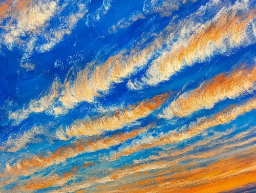 Paisaje con nubes y un cielo azul al atardecer