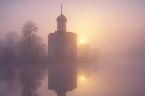 Silhouette of a temple against a misty morning and a rising sun