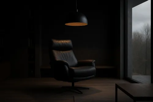 Dark room with an armchair, lamp, and window