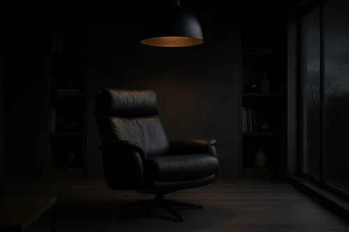 Armchair in a Dark Room with Soft Light Above It