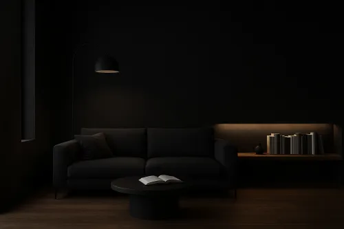 Sala de estar elegante con sofá negro y muebles negros, iluminada con luz cálida