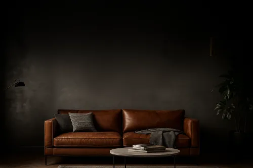 Comfortable light brown leather sofa with cushions