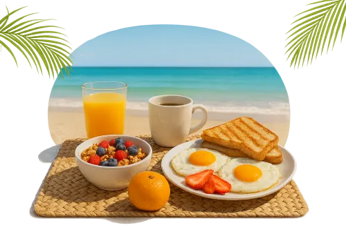 Beautifully arranged breakfast with eggs and fruits on the beach