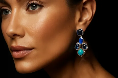 Close-up of a woman's face with bright earrings and expressive eyes