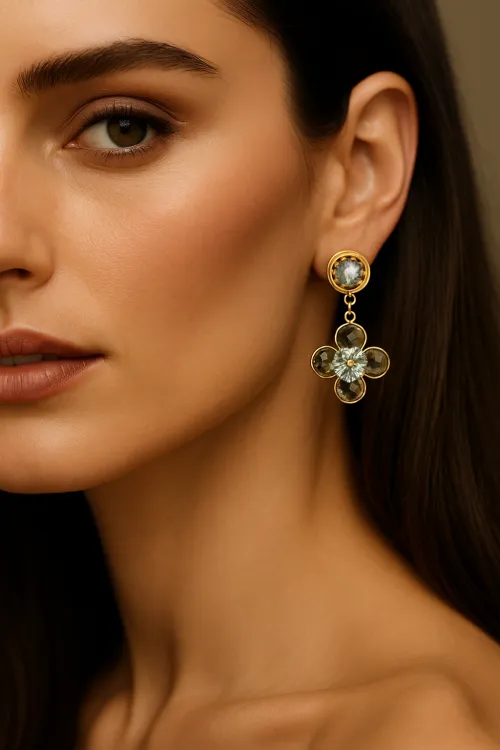 Image of a woman wearing flower-shaped earrings made of gold alloy