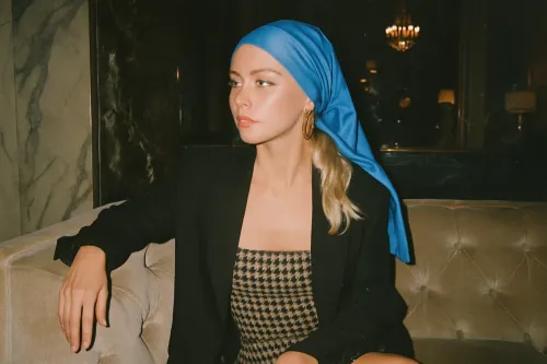 Girl in a black jacket and silk headscarf