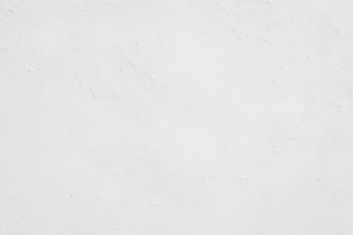 Pared blanca con ligera textura y pequeñas irregularidades