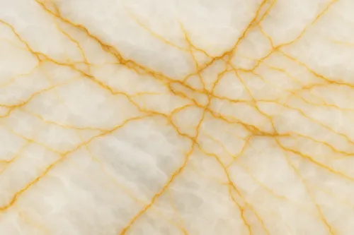 Surface of light marble with golden lines and veins