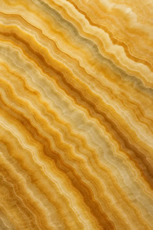 Natural stone with wavy texture in shades of yellow and patterns