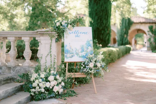 Elegant welcome sign surrounded by flowers in a beautiful garden