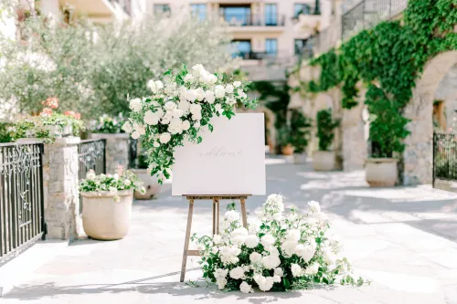 Elegant Wedding Stand with Flowers and Welcome Sign
