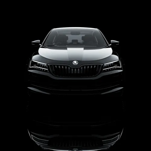Front view of a black car with a shiny surface on a black background