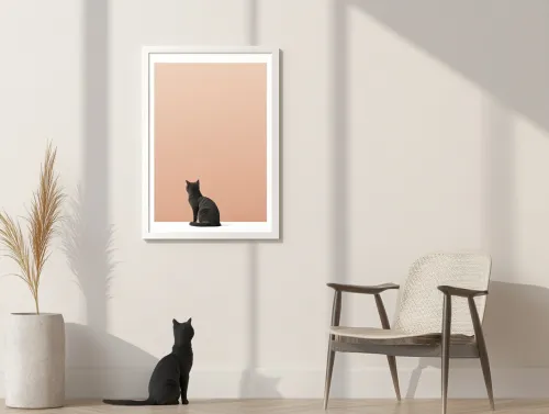 Black cat sitting in front of a painting in a cozy room