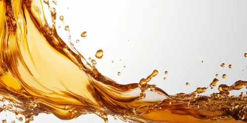 Image of flowing caramel liquid with water splashes