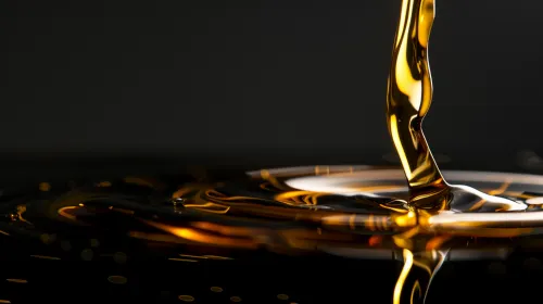 Fluidity and Shine of Oil on a Black Surface