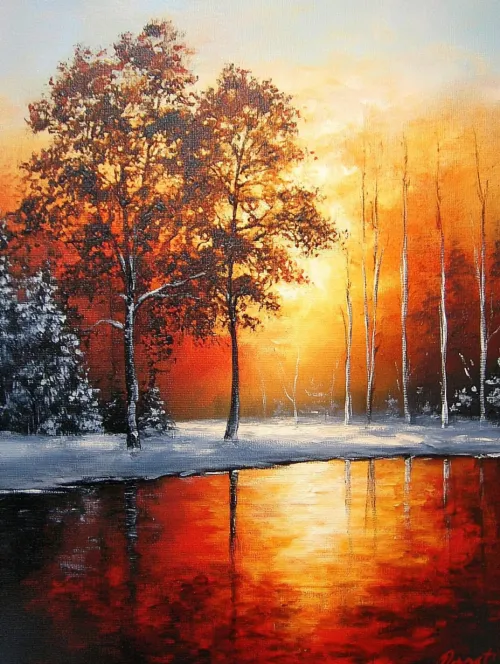 Winter landscape with a river and trees against the backdrop of a sunset