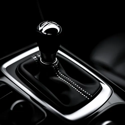 Gear shift lever in the interior of a modern car on a black background