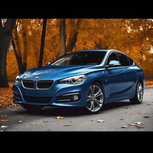 Blue BMW against a backdrop of golden autumn trees