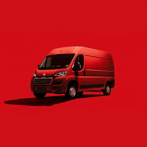 Bright red Peugeot van on a solid red background