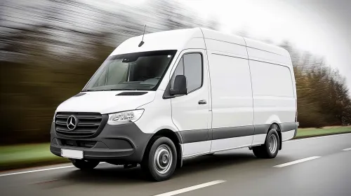 Mercedes-Benz van driving on the road with a blurred background