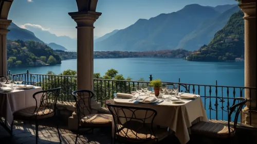 Elegant dining table in a restaurant with a view of a beautiful lake and mountains