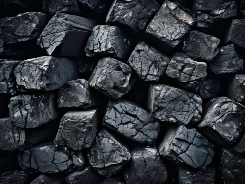 Black coal blocks arranged in a haphazard manner