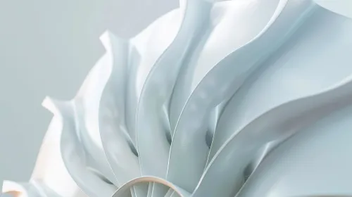 Detail of an abstract sculpture with smooth wavy shapes in soft tones