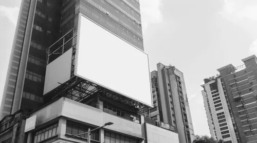 Empty billboard on a skyscraper in an urban environment