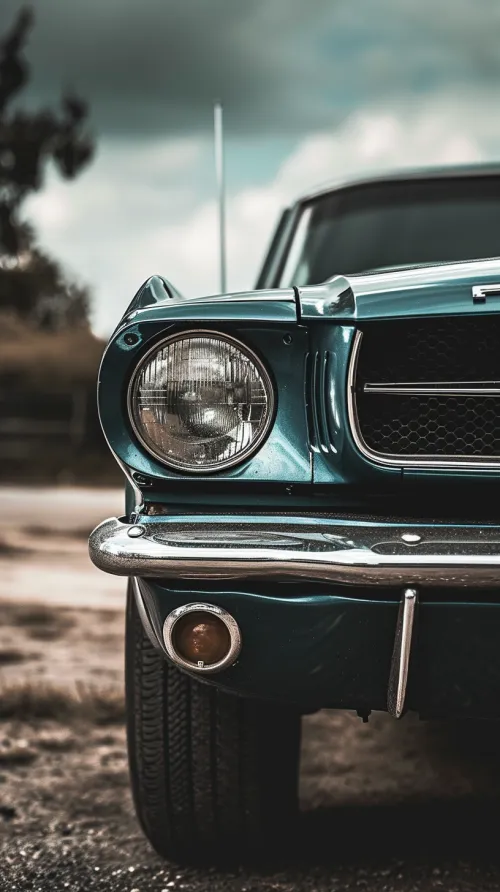 Image of a classic car with a bright blue body and chrome elements