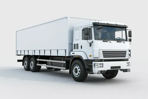 Camión blanco con una gran caja, destinado al transporte de mercancías