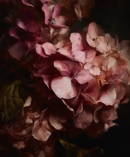 A bouquet of pink flowers with rich texture and a dark background