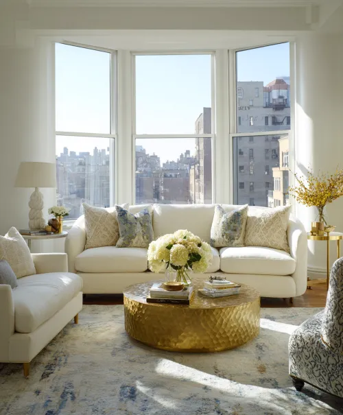 Bright modern living room with windows and stylish furniture