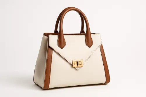 Elegant handbag with brown leather handles and a modern design.