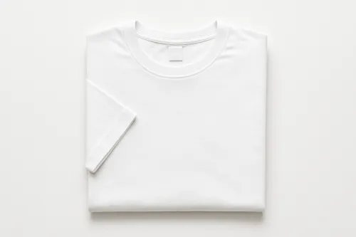 Simple white t-shirt neatly folded on a light background