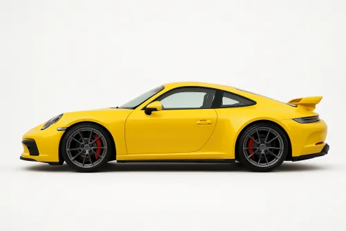 Side view of a yellow sports car with black rims and red brakes