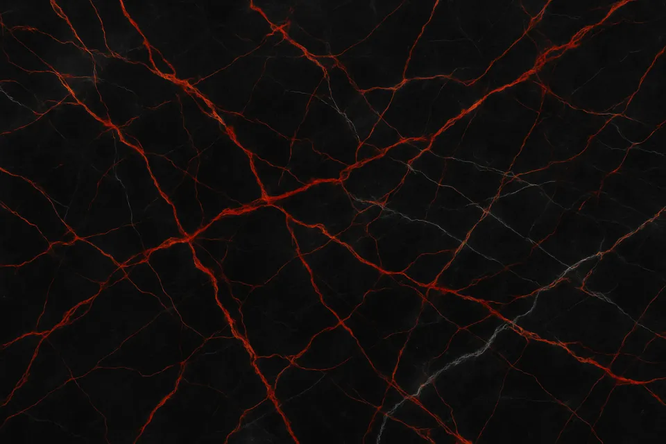 Background of black marble with vibrant red veins and white streaks