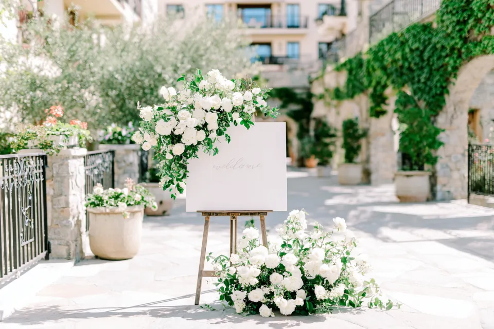 Elegant Wedding Stand with Flowers and Welcome Sign