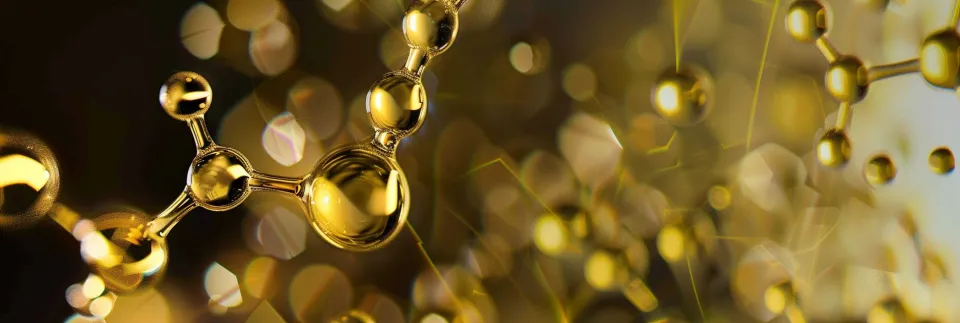 Close-up of molecules with golden light and sparkling particles