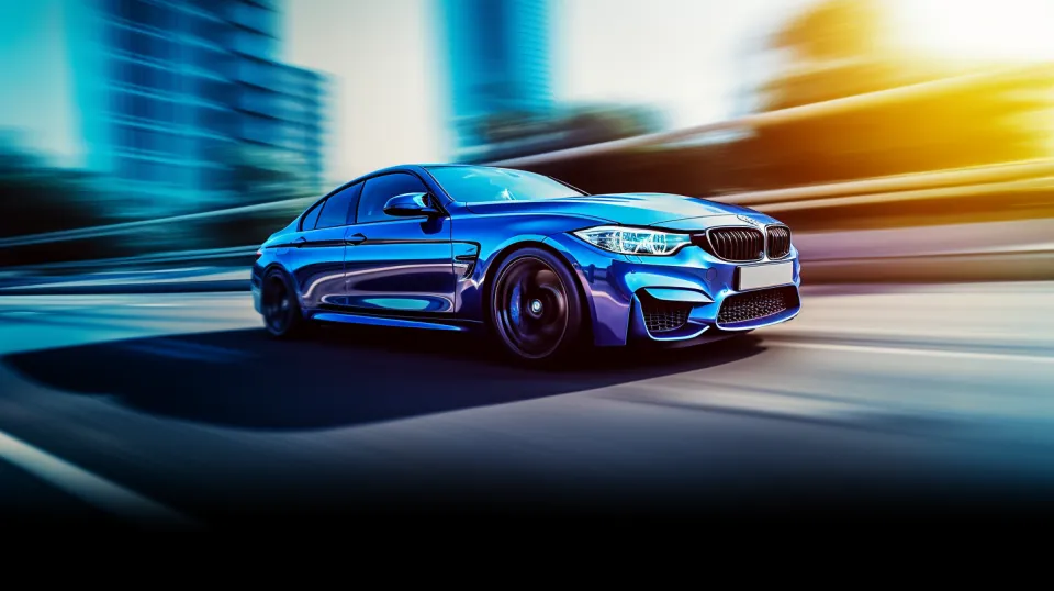 Синий спортивный автомобиль BMW движется по дороге в городском пейзаже