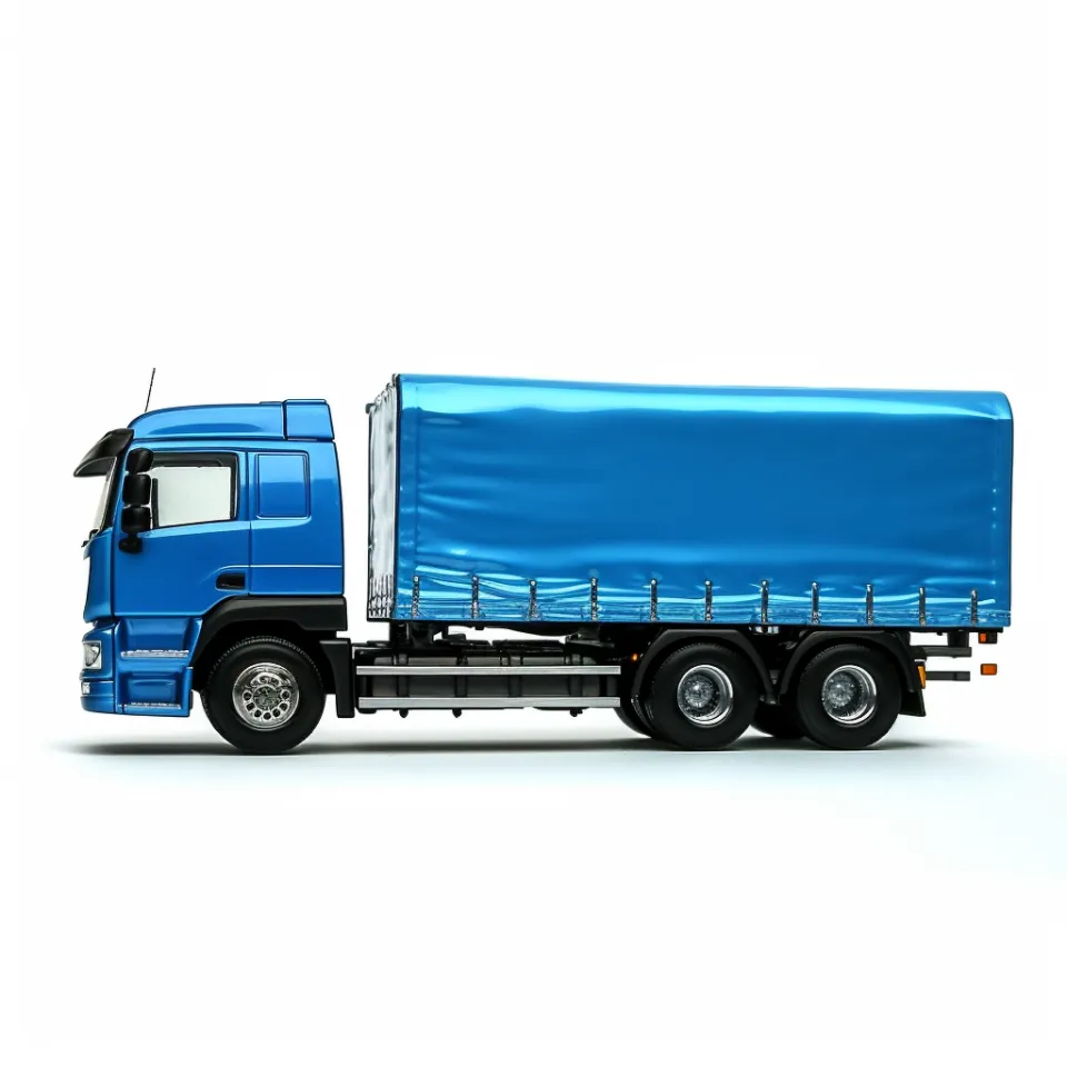 Side view of a blue truck with a tarpaulin and a trailer