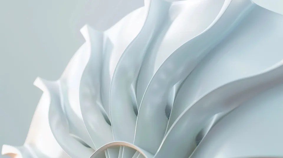 Detail of an abstract sculpture with smooth wavy shapes in soft tones