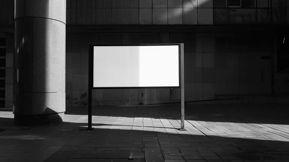 Advertising panel with empty space against the backdrop of city buildings