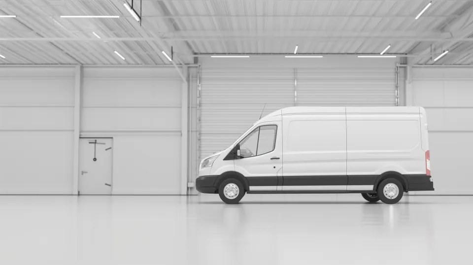 Light-colored van in a clean, spacious area
