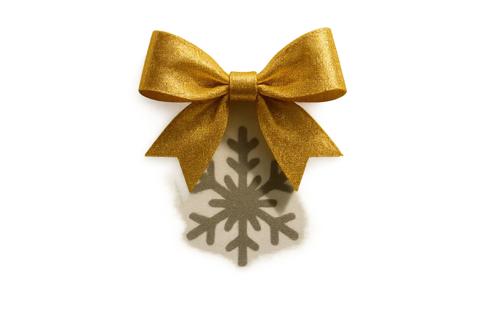 Яркий золотой бантик и его тень в форме снежинки